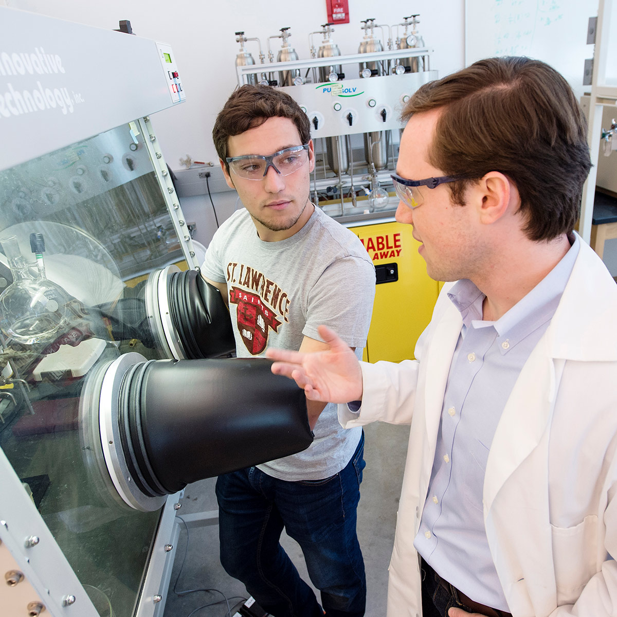Faculty member working with student in lab