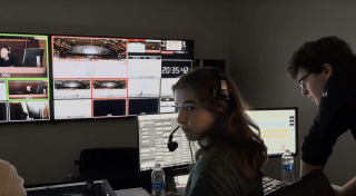 Maya Mackety working on live streaming production for Athletics
