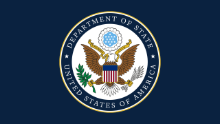 The U.S. Department of State logo, , which is circular with a narrow gold ring on the outside, a narrow white ring just inside and a blue ring inside that which reads "* DEPARTMENT OF STATE * UNITED STATES OF AMERICA." Inside that blue ring is an eagle grasping an olive branch in the left talon and arrows in the right. The eagle's beak is holding a gold ribbon that reads "E PLURIBUS UNUM" and a modified version of the American flag sits on the eagle's chest.