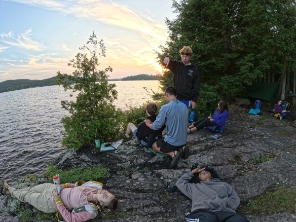 Relaxing at a lakeside campsite.