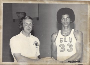 A scanned photo from 1975 of Tony Ross, class of 1975, with basketball coach Paul Evans. 