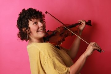 Danica Cunningham '13 plays a fiddle