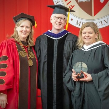 Graduation 2024 - Photo of President Kate Morris, Trustee Tim Simpson, and award winner Cali Brooks 