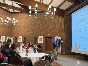 man presenting at lecture